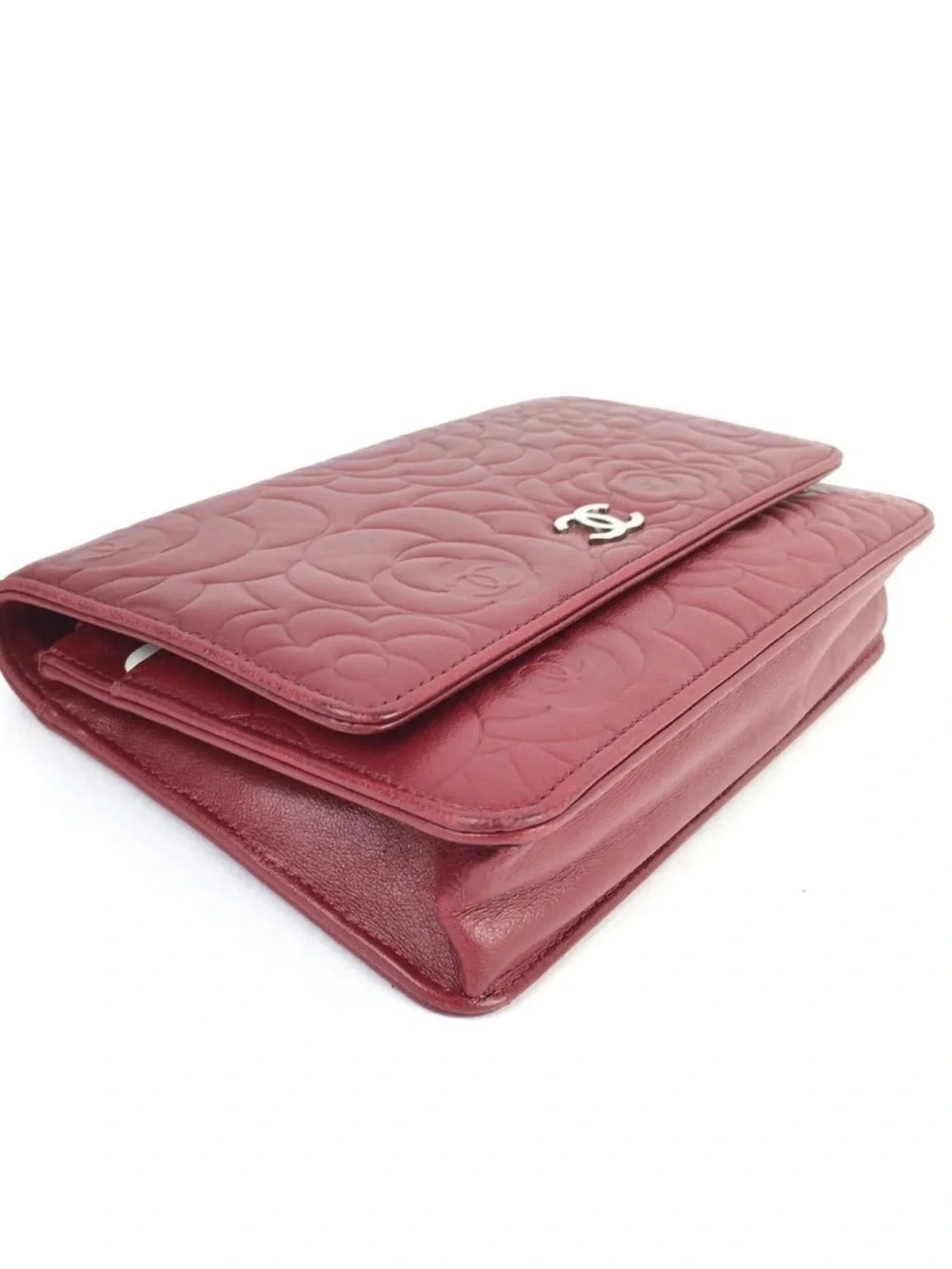 CHANEL Camellia-Embossed Leather Clutch in Deep Red with Silver CC